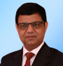 Dr. Surender Mohan Gupta, Global Chief People Officer, Startek, seen posing for a photo in a black color suit
